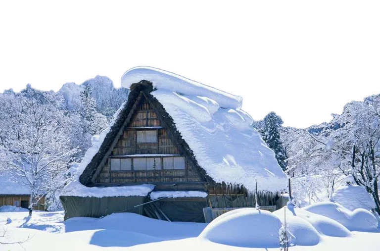 Snow-Covered Traditional Wooden House